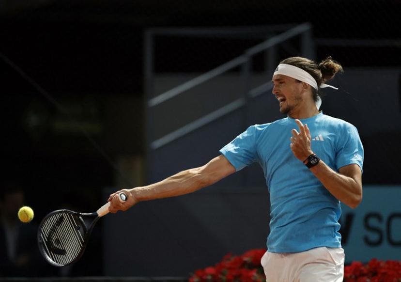 Germany's Alexander Zverev returns the ball to Czech Republic's Jakub Mensik during their 2026 ATP Tour Madrid Open tennis tournament singles match at the Caja Magica in Madrid, on April 28, 2026.  OSCAR DEL POZO / AFP