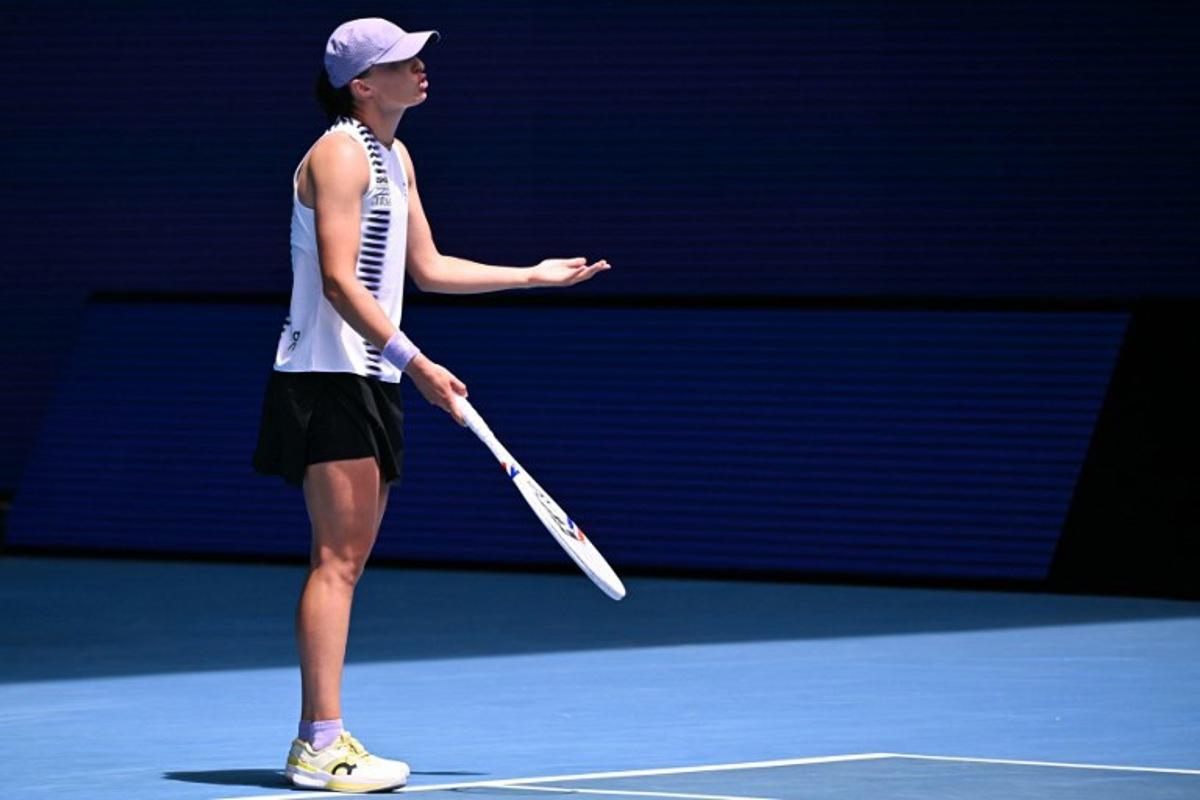 Poland's Iga Swiatek reacts on a point against Kazakhstan's Elena Rybakina during their women's singles quarter-final match on day eleven of the Australian Open tennis tournament in Melbourne on January 28, 2026.  WILLIAM WEST / AFP