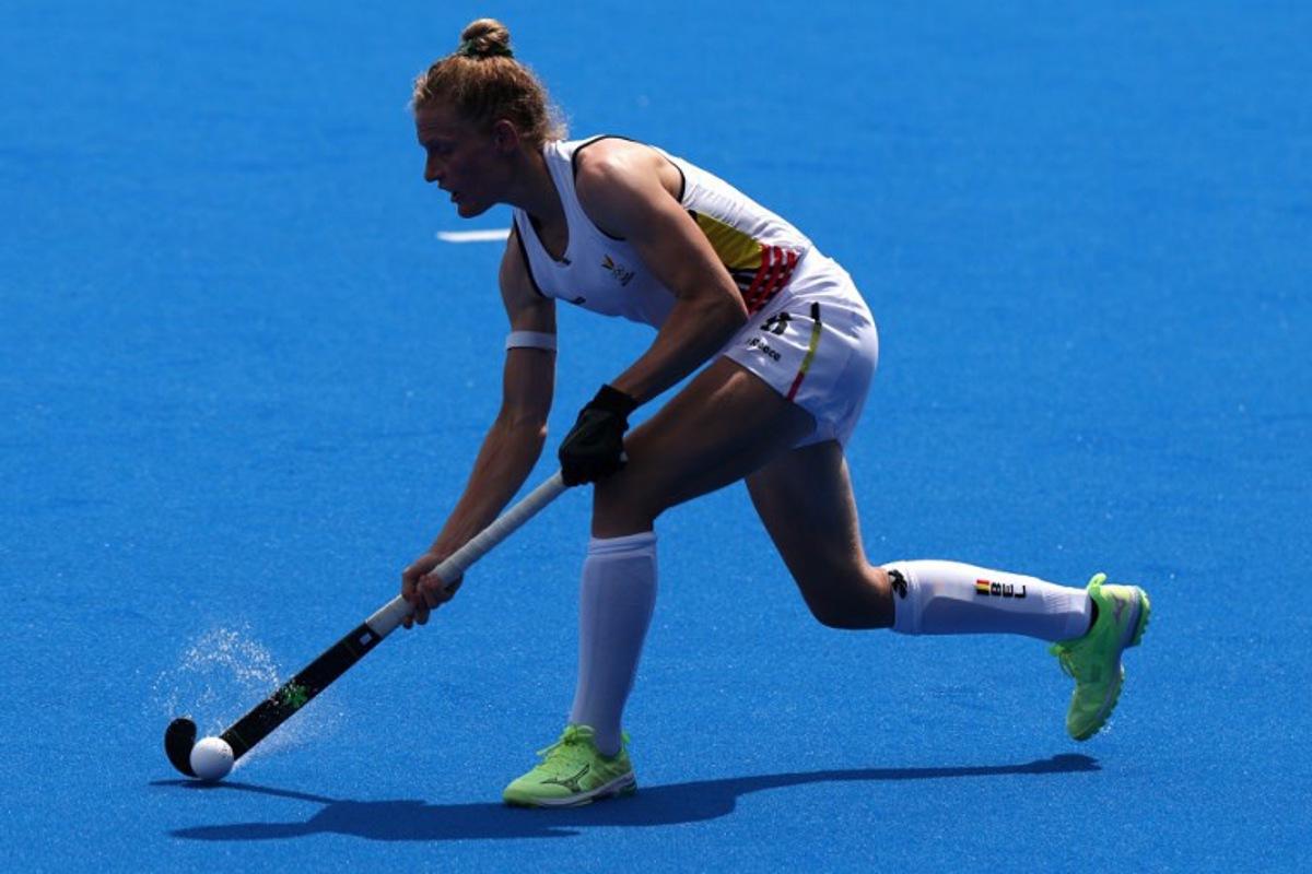 Belgium's defender #08 Emma Puvrez passes the ball in the women's pool A field hockey match between Belgium and the Netherlands during the Paris 2024 Olympic Games at the Yves-du-Manoir Stadium in Colombes on August 2, 2024.  Ahmad GHARABLI / AFP