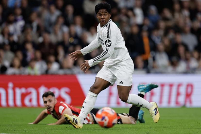Real Madrid's Brazilian forward #16 Endrick watches the ball during the Spanish league football match between Real Madrid CF and Athletic Club Bilbao at the Santiago Bernabeu Stadium in Madrid, on April 20, 2025.  OSCAR DEL POZO / AFP
