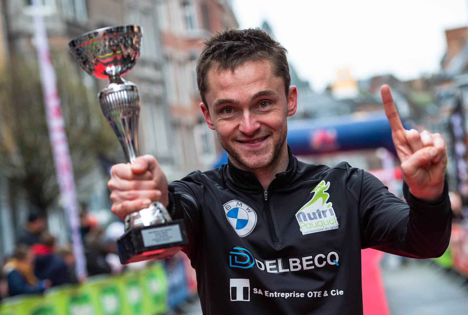 Amaury Paquet celebrates as he wins the Namur Marathon, Sunday 02 April 2023. BELGA PHOTO MAXIME ASSELBERGHS
