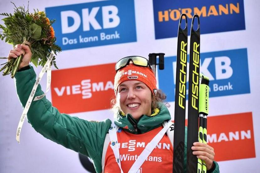 Runner up Germany's Laura Dahlmeier celebrates on the podium after the women's 10km pursuit event of the IBU Biathlon World Cup in Rasen-Antholz (Rasun Anterselva), Italian Alps, on January 26, 2019.  Marco BERTORELLO / AFP
