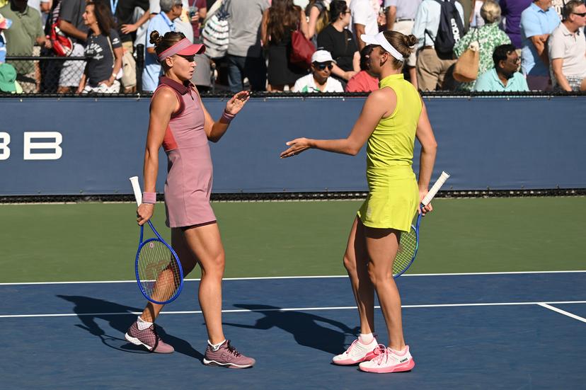 Belgian Elise Mertens (yellow) and Veronika Kudermetova (pink) pictured during a tennis match against US pair Brantmeier-Hamilton, in the second round of the women's doubles of the 2025 US Open Grand Slam tennis tournament in New York City, USA, Saturday 30 August 2025. BELGA PHOTO TONY BEHAR