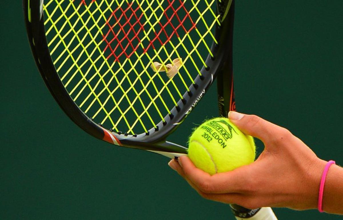 Russia's Maria Kirilenko prepares to serve during her second round women's singles match on day three of the 2012 Wimbledon Championships tennis tournament at the All England Tennis Club in Wimbledon, southwest London, on June 27, 2012. AFP PHOTO / MIGUEL MEDINA  RESTRICTED TO EDITORIAL USE  MIGUEL MEDINA / AFP