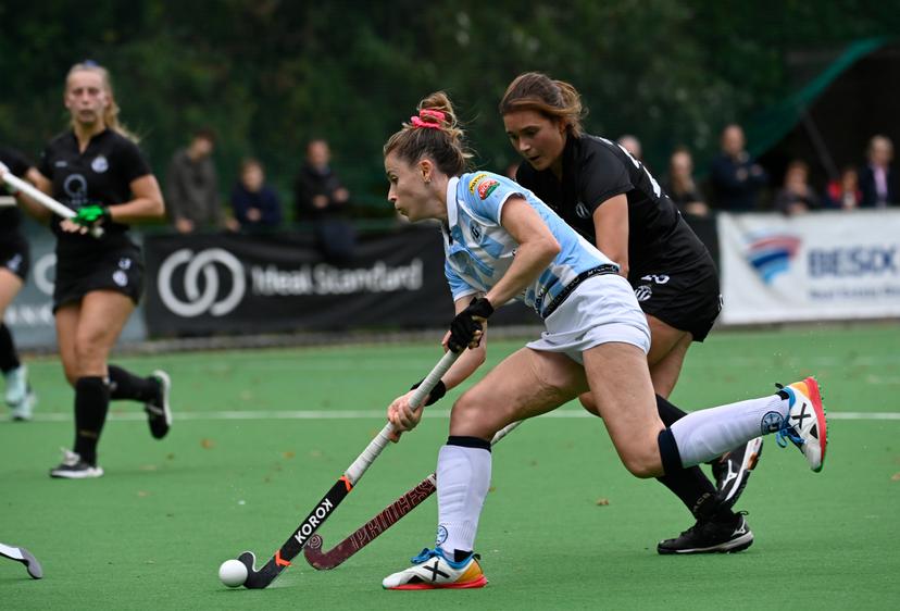 Racing's Charlotte Englebert and Gantoise's Alix Gerniers fight for the ball during a hockey match between Racing and Gantoise, Sunday 16 October 2022 in Ukkel-Uccle, Brussels, on day 8 of the Belgian Women's Hockey League season 2022-2023. BELGA PHOTO JOHN THYS