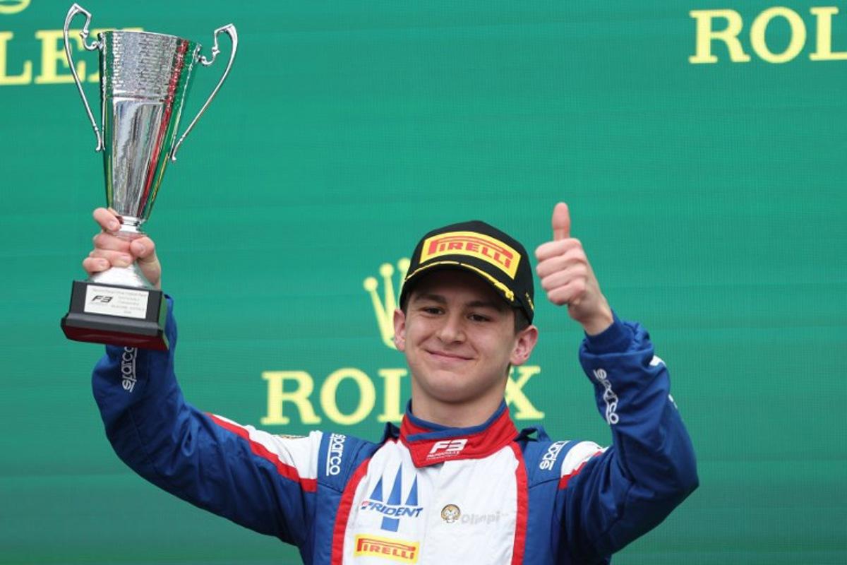 Second-placed Trident's Italian driver Leonardo Fornaroli celebrates on the podium after the Australia Formula 3 Grand Prix at the Albert Park Circuit in Melbourne on March 24, 2024.  Martin KEEP / AFP