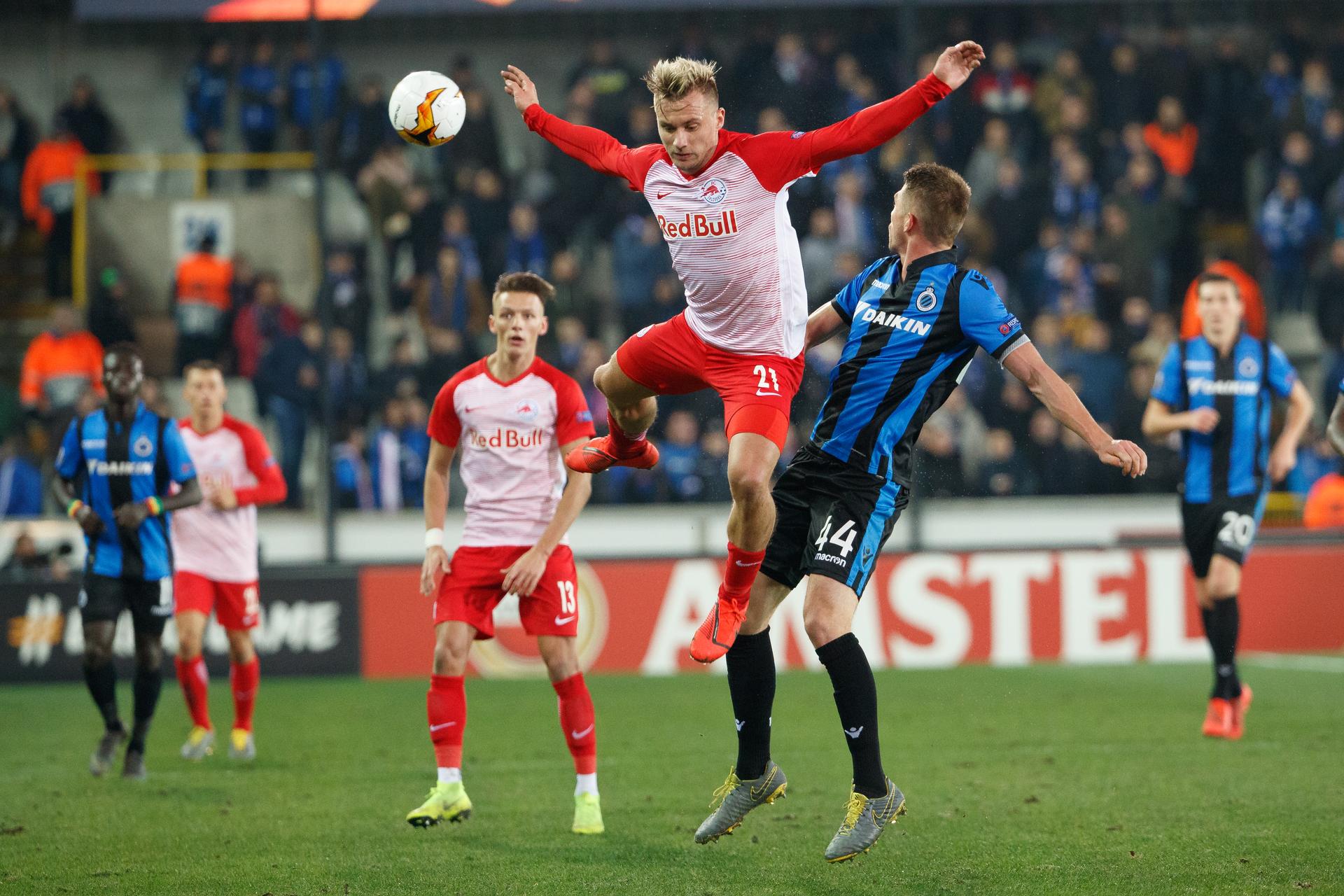 Salzburg's Fredrik Gulbrandsen and Club's Brandon Mechele fight for the ball during a soccer game between Belgian team Club Brugge KV and Austrian club FC Red Bull Salzburg, the first leg of the 1/16 finals (round of 32) in the Europa League competition, Thursday 14 February 2019 in Brugge. BELGA PHOTO KURT DESPLENTER