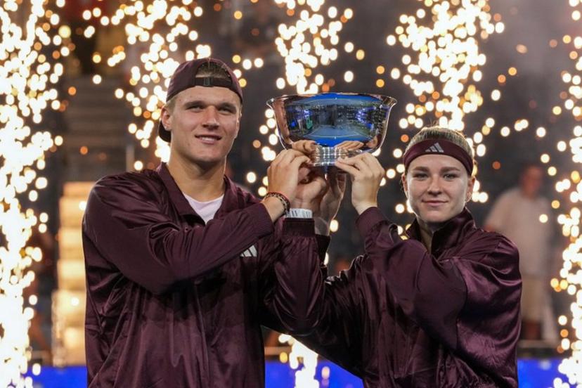Czech Republic's Jakub Mensik and Czech Republic's Karolina Muchova hold up the trophy after they beat Switzerland's Belinda Bencic and Italy's Flavio Cobolli in the mixed doubles final tennis match of the 2026 US Open tennis tournament at the USTA Billie Jean King National Tennis Center in New York on August 26, 2026.  TIMOTHY A. CLARY / AFP