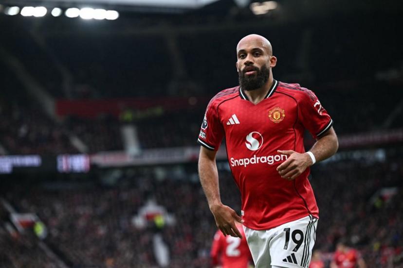 Manchester United's Cameroonian midfielder #19 Bryan Mbeumo prepares to take a corner during the English Premier League football match between Manchester United and Fulham at Old Trafford in Manchester, north west England, on February 1, 2026.  Paul ELLIS / AFP