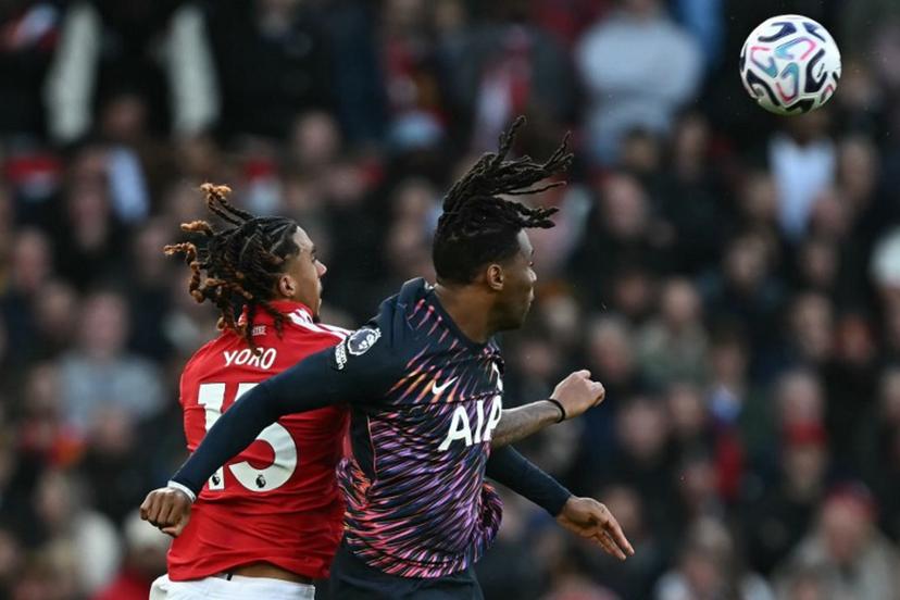 Manchester United's French defender #15 Leny Yoro (L) vies with Tottenham Hotspur's Italian defender #13 Destiny Udogie (R) during the English Premier League football match between Manchester United and Tottenham Hotspur at Old Trafford in Manchester, north west England, on October 10, 2026.  Paul ELLIS / AFP