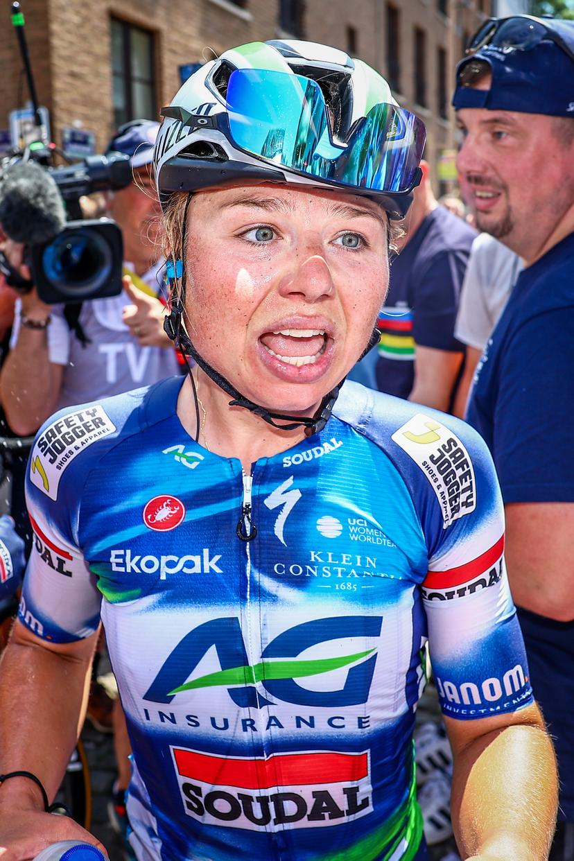 Belgian Justine Ghekiere of AG Insurance-Soudal Team celebrates after winning the women's elite road race of the Belgian Cycling Championships, 132,8 km from and to the Grand Place square in Binche on Sunday 29 June 2025. BELGA PHOTO DAVID PINTENS