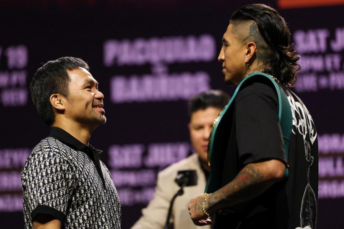 Filipino boxer Manny Pacquiao (L) and Mexican-US boxer Mario Barrios face off during the press conference ahead of their July 19 WBC welterweight title fight at the NOVO at L.A. Live in Los Angeles on June 3, 2025. Manny Pacquiao on June 3 shrugged off concerns about his decision to return to boxing at the age of 46 as he prepares for next month's world welterweight title comeback against Mario Barrios. The charismatic Filipino boxing icon stunned the sports world last month after announcing he would take on World Boxing Council (WBC) champion Barrios on July 19 in Las Vegas, four years after his last fight ended in a disappointing defeat.  Patrick T. Fallon / AFP