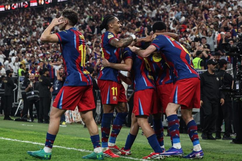 Barcelona's Polish forward #09 Robert Lewandowski celebrates with teammates after scoring his team's second goal during the Spanish Super Cup final football match between FC Barcelona and Real Madrid at the King Abdullah Stadium in Jeddah on January 11, 2026.  Fadel SENNA / AFP