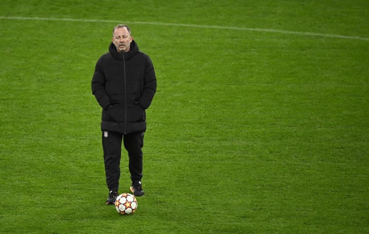 Besiktas' Turkish coach Sergen Yalcin overses a training session at the Signal-Iduna Park in Dortmund, western Germany, on December 6, 2021, on the eve of their UEFA Champions League Group C football match against Borussia Dortmund.   Ina FASSBENDER / AFP