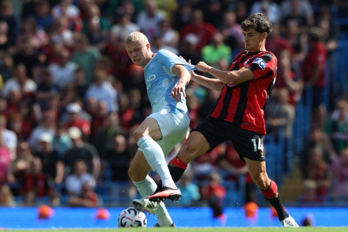 Manchester City's Norwegian striker #09 Erling Haaland (L) vies with Bournemouth's Portugese defender #14 Antonio Silva (R) during the English Premier League football match between Manchester City and AFC Bournemouth  at the Etihad Stadium in Manchester, north west England, on August 23, 2026.  Darren Staples / AFP