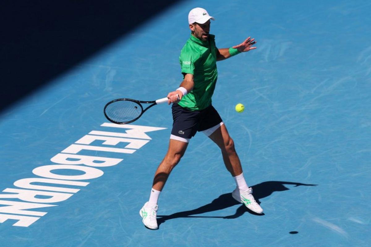 Serbia's Novak Djokovic hits a shot against Italy's Francesco Maestrelli during their men's singles match on day five of the Australian Open tennis tournament in Melbourne on January 22, 2026.  IZHAR KHAN / AFP