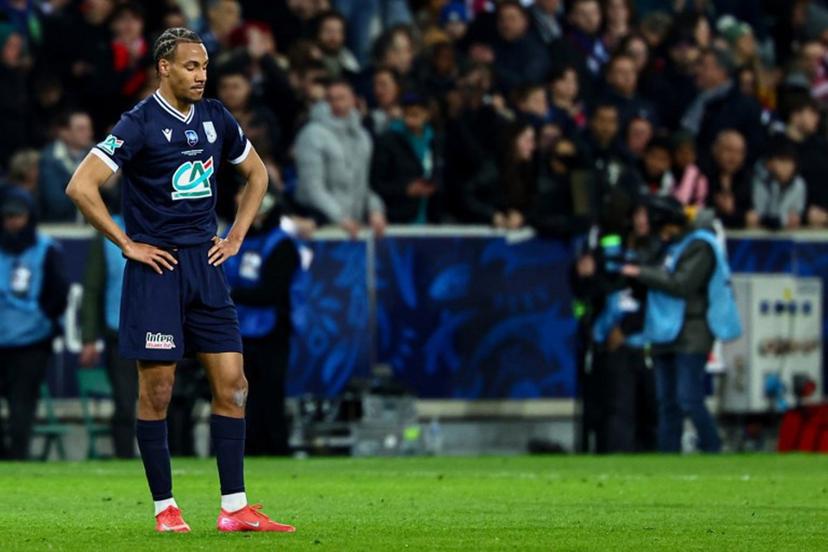 Dunkerque's French defender #21 Geoffrey Kondo reacts at end of the French Cup (Coupe de France) semi-final football match between USL Dunkerque and Paris Saint-Germain (PSG) at the Pierre-Mauroy stadium in Villeneuve-d'Ascq, northern France, on April 1, 2025.  Sameer Al-Doumy / AFP