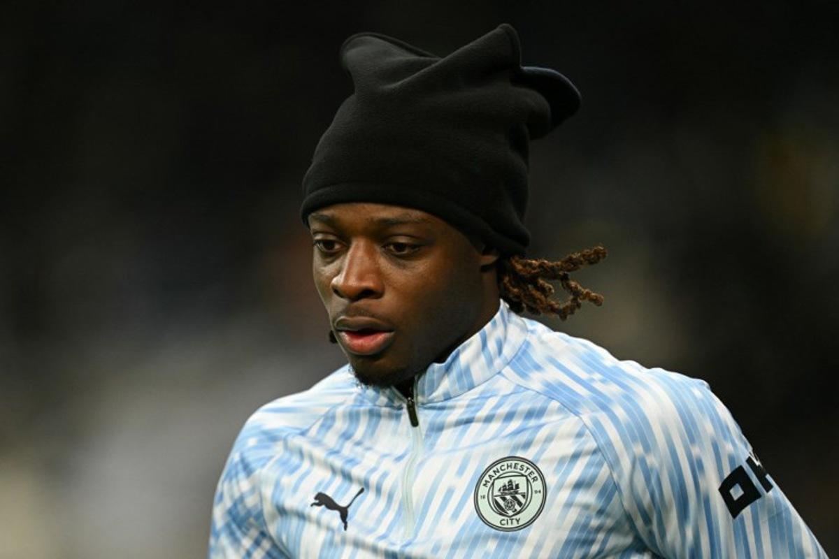Manchester City's Belgian midfielder #11 Jeremy Doku warms up ahead of the English League Cup semi-final first leg football match between Newcastle United and Manchester City at St James' Park in Newcastle-upon-Tyne, north east England on January 13, 2026.  Oli SCARFF / AFP