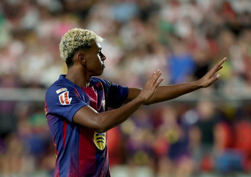 Barcelona's Spanish forward #10 Lamine Yamal celebrates scoring his team's first goal from the penalty spot during the Spanish league football match between Rayo Vallecano de Madrid and FC Barcelona at the Vallecas stadium in Madrid on August 31, 2025.  Pierre-Philippe MARCOU / AFP
