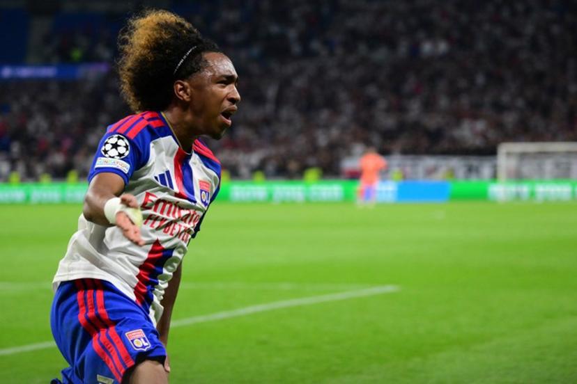 Lyon's Belgian forward #11 Malick Fofana celebrates after scoring Lyon's first goal during the UEFA Champions League qualifying playoff - second leg football match between Olympique Lyonnais (OL) and Fenerbahce SK and at the Groupama Stadium in Decines-Charpieu, central-eastern France, on August 26, 2026.  Olivier CHASSIGNOLE / AFP