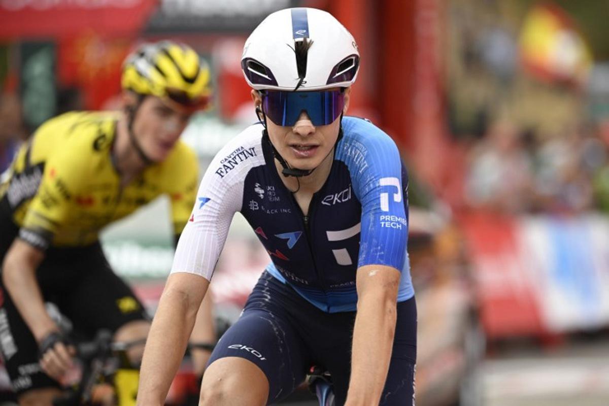 Team Israel Premier Tech 's US rider Matthew Riccitello crosses the finish line during the 14th stage of the Vuelta a Espana cycling tour, a 135 km race between Aviles and La Farrapona in Somiedo, on September 6, 2025.   Cycling team Israel-Premier Tech removed their name from their kit at the Vuelta a Espana today after pro-Palestine protests aimed at them during the race. Miguel RIOPA / AFP
