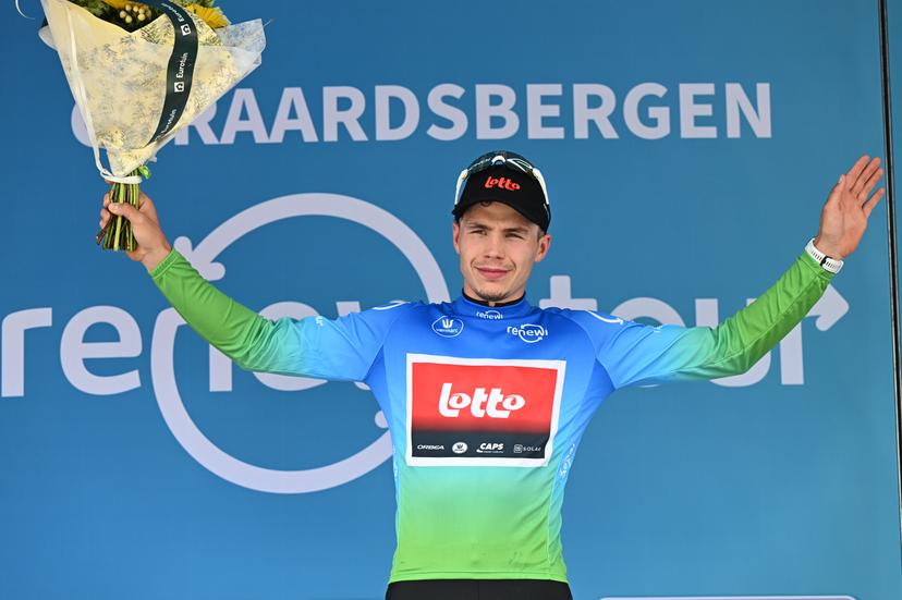 Belgian Arnaud De Lie of Lotto Cycling Team celebrates on the podium in the leaders jersey, after the third stage of the 'Renewi Tour' multi-stage cycling race, from Aalter to Geraardsbergen (179,9 km) on Friday 22 August 2025. The five-day race takes place in Belgium and the Netherlands.  BELGA PHOTO DAVID PINTENS