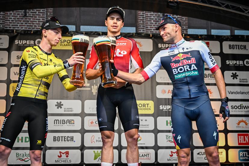British James Matthew Brennan of Team Visma-Lease a Bike, Belgian Arnaud De Lie of Lotto Cycling Team and Belgian Jordi Meeus of RedBull-BORA-hansgrohe pictured on the podium after the Super 8 Classic one day cycling race 200,7km from Brakel to Boortmeerbeek, on Saturday 20 September 2025. BELGA PHOTO DAVID PINTENS
