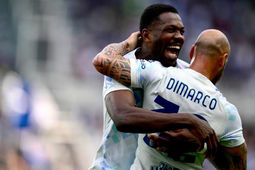 Inter Milan's French forward #9 Marcus Thuram (L) celebrates with Inter Milan's Italian defender #32 Federico Dimarco (R) after scoring Inter's first goal during the Italian Serie A football match between Torino and Inter Milan at the Olympic Stadium Grande Torino in Turin on April 26, 2026.  MARCO BERTORELLO / AFP