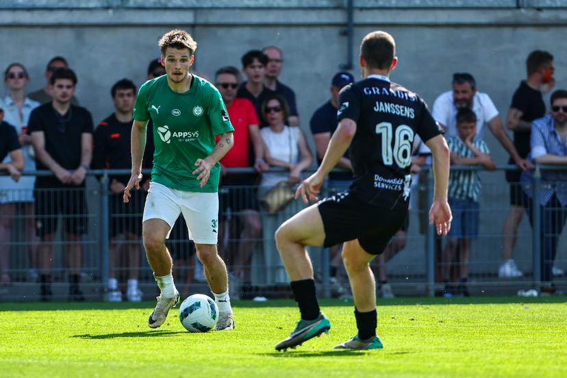 Lommel's Juho Talvitie and Deinze's Christophe Janssens fight for the ball during a soccer match between KMSK Deinze and Lommel SK, Sunday 12 May 2024 in Deinze, the second leg of the semi-final for the promotion at the end of the 2023-2024 'Challenger Pro League' second division of the Belgian championship. BELGA PHOTO DAVID PINTENS