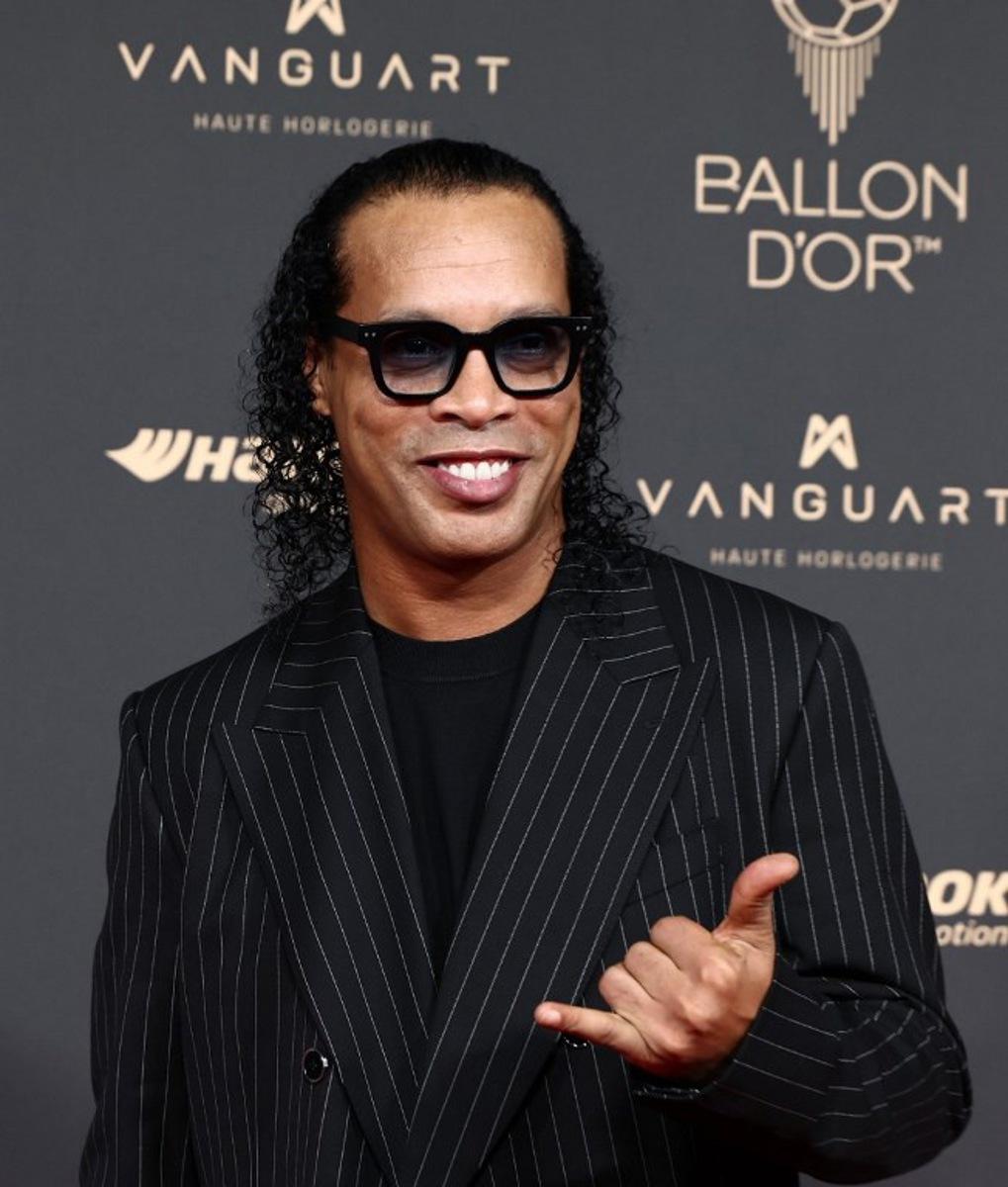 Brazilian former football player Ronaldinho poses upon arrival before the 2025 Ballon d'Or France Football award ceremony at the Theatre du Chatelet in Paris on September 22, 2025.   FRANCK FIFE / AFP