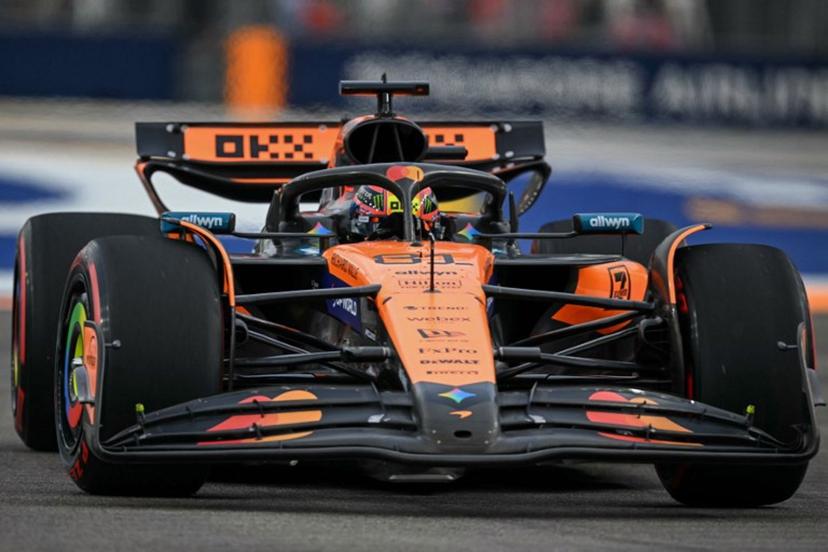 McLaren's Australian driver Oscar Piastri drives during the first practice session ahead of the Formula One Singapore Grand Prix night race at the Marina Bay Street Circuit in Singapore on October 3, 2025.  MOHD RASFAN / AFP