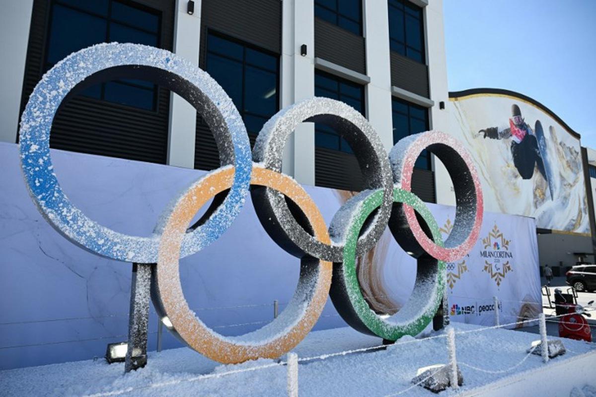 The Olympic Rings are displayed outside a sound stage during an NBC Universal Team USA filming event ahead of the 2026 Winter Olympics at the Sunset Glenoaks studios in Los Angeles, California on May 21, 2025.  Patrick T. Fallon / AFP