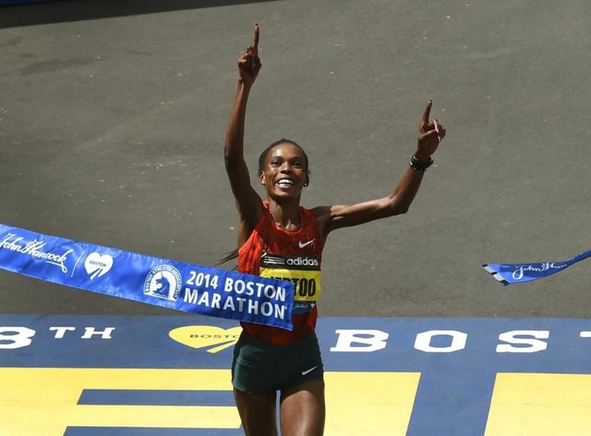 Rita Jeptoo of Kenya reacts as she crosses the finish line to win the Women's Elite division of the 118th Boston Marathon in Boston, Massachusetts April 21, 2014.  AFP PHOTO / Timothy A. CLARY  TIMOTHY A. CLARY / AFP