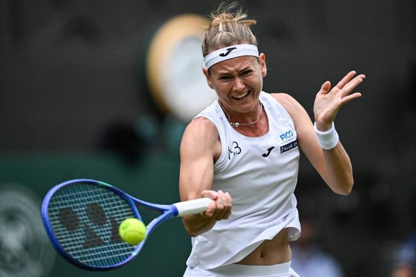 Czech Republic's Marie Bouzkova plays a forehand return to Belarus's Aryna Sabalenka during their women's singles second round tennis match on the third day of the 2025 Wimbledon Championships at The All England Lawn Tennis and Croquet Club in Wimbledon, southwest London, on July 2, 2025.  Kirill KUDRYAVTSEV / AFP