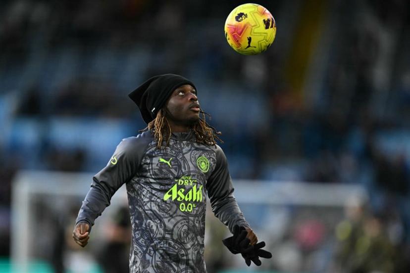 Manchester City's Belgian midfielder #11 Jeremy Doku warms up ahead of the English Premier League football match between Leeds United and Manchester City at Elland Road in Leeds, northern England on February 28, 2026.  Oli SCARFF / AFP
