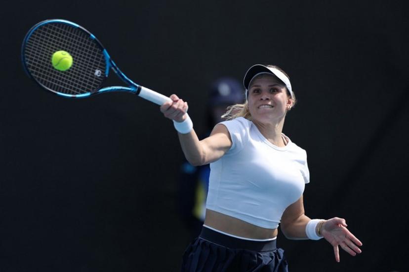 Croatia's Jana Fett hits a return against Britain's Harriet Dart during their women's singles match on day two of the Australian Open tennis tournament in Melbourne on January 13, 2025.  Adrian Dennis / AFP