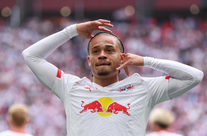 Leipzig's Dutch midfielder #10 Xavi Simons celebrates scoring the opening goal with his teammates during the German first division Bundesliga football match between RB Leipzig and VfB Stuttgart in Leipzig, eastern Germany, on May 17, 2025.  Ronny HARTMANN / AFP