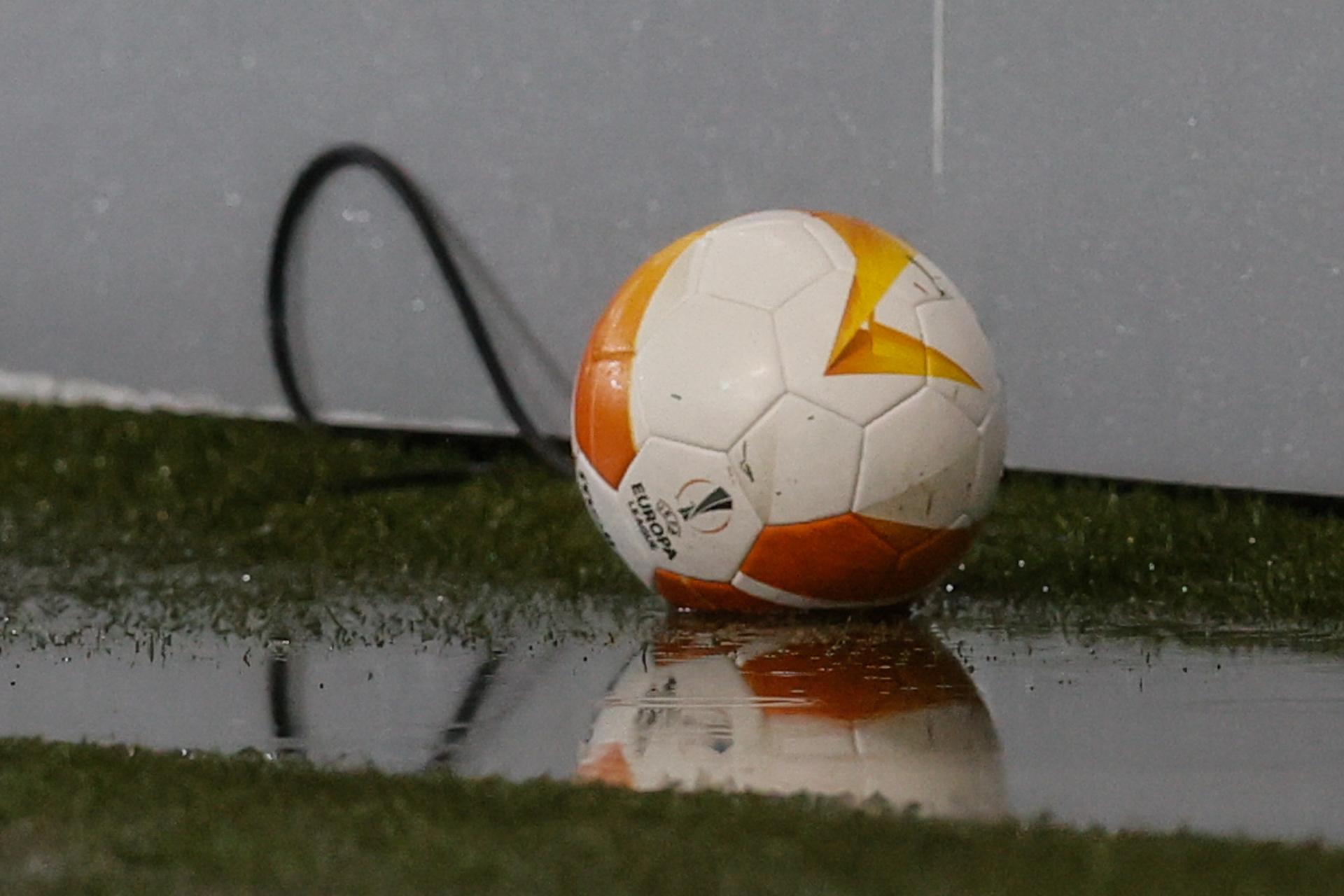 Illustration picture shows a ball in a puddle of rain, before a soccer match between Belgian team Standard de Liege and Scottish club Rangers FC, Thursday 22 October 2020 in Liege, on the first day of the group phase (group D) of the UEFA Europa League competition. BELGA PHOTO BRUNO FAHY