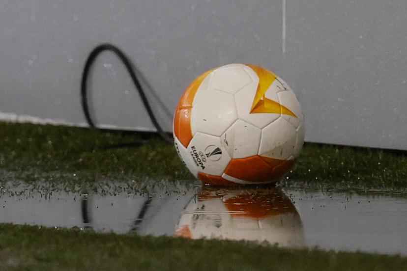 Illustration picture shows a ball in a puddle of rain, before a soccer match between Belgian team Standard de Liege and Scottish club Rangers FC, Thursday 22 October 2020 in Liege, on the first day of the group phase (group D) of the UEFA Europa League competition. BELGA PHOTO BRUNO FAHY