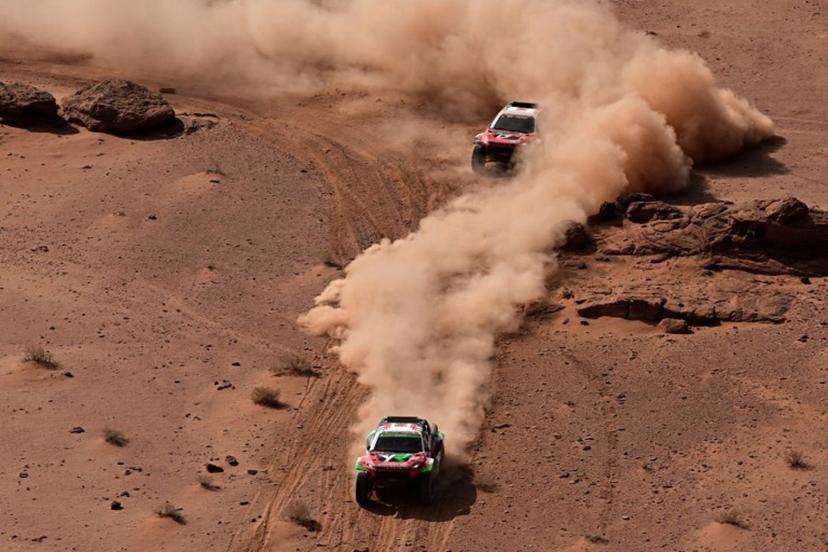 Overdrive Racing's Saudi driver Yazeed al-Rajhi and German co-driver Timo Gottschalk (front) overtake Toyota Gazoo Racing W2RC's South African driver Henk Lategan and South African co-driver Breet Cummings during the Stage 3 of the 48th edition of the Dakar Rally, between Al-Ula and Al-Ula in Saudi Arabia, on January 6, 2026.  Giuseppe CACACE / AFP