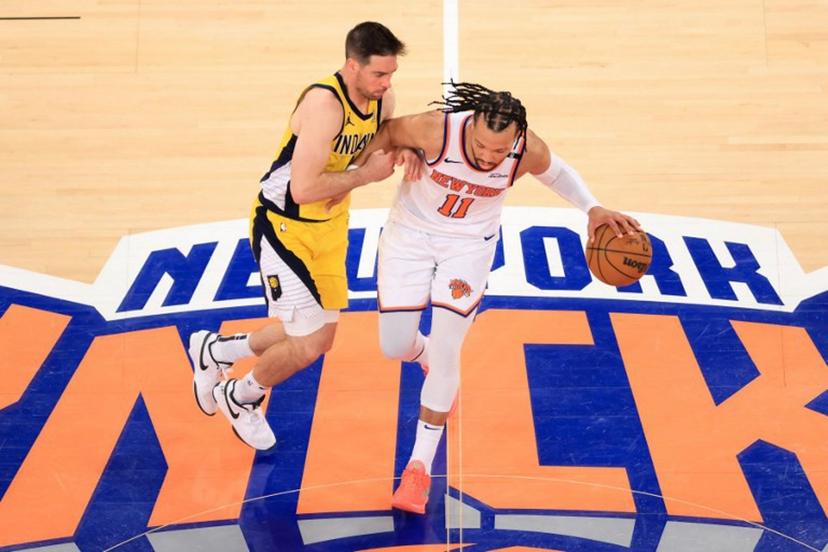 Knicks' point guard #11 Jalen Brunson (R) dribbles the ball under pressure from the Pacers' point guard #09 TJ McConnell (L) during Game Five of the Eastern Conference Finals of the 2025 NBA Playoffs between the New York Knicks and the Indiana Pacers at Madison Square Garden in New York on May 29, 2025.  CHARLY TRIBALLEAU / AFP