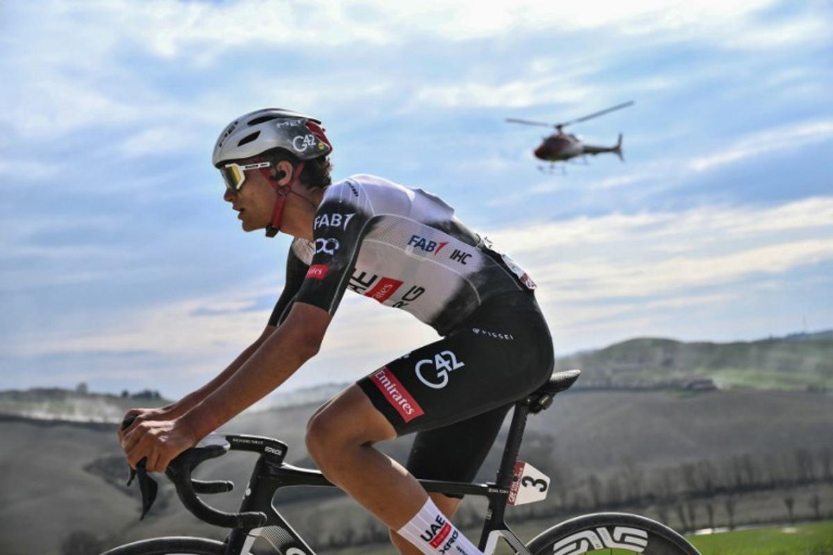 Team UAE's Mexican rider Isaac Del Toro rides during the 19th one-day classic Strade Bianche (White Roads) men's cycling race between Siena and Siena in Tuscany on March 8, 2025.  Marco BERTORELLO / AFP