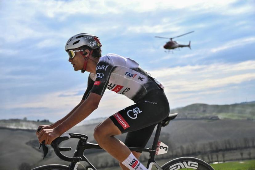 Team UAE's Mexican rider Isaac Del Toro rides during the 19th one-day classic Strade Bianche (White Roads) men's cycling race between Siena and Siena in Tuscany on March 8, 2025.  Marco BERTORELLO / AFP