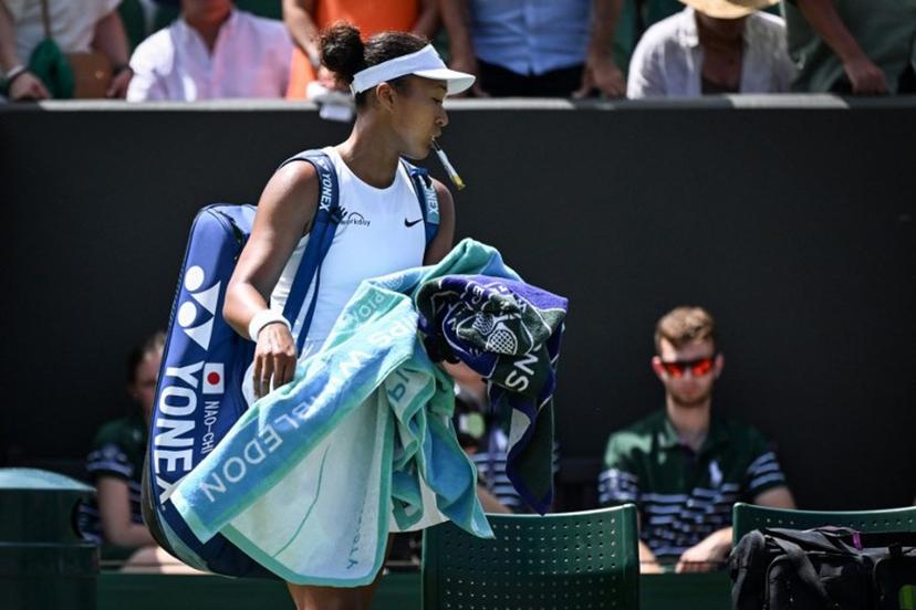 Japan's Naomi Osaka reacts as she leaves the court following her defeat against Russia's Anastasia Pavlyuchenkova at the end of their women's singles third round tennis match on the fifth day of the 2025 Wimbledon Championships at The All England Lawn Tennis and Croquet Club in Wimbledon, southwest London, on July 4, 2025.  Kirill KUDRYAVTSEV / AFP
