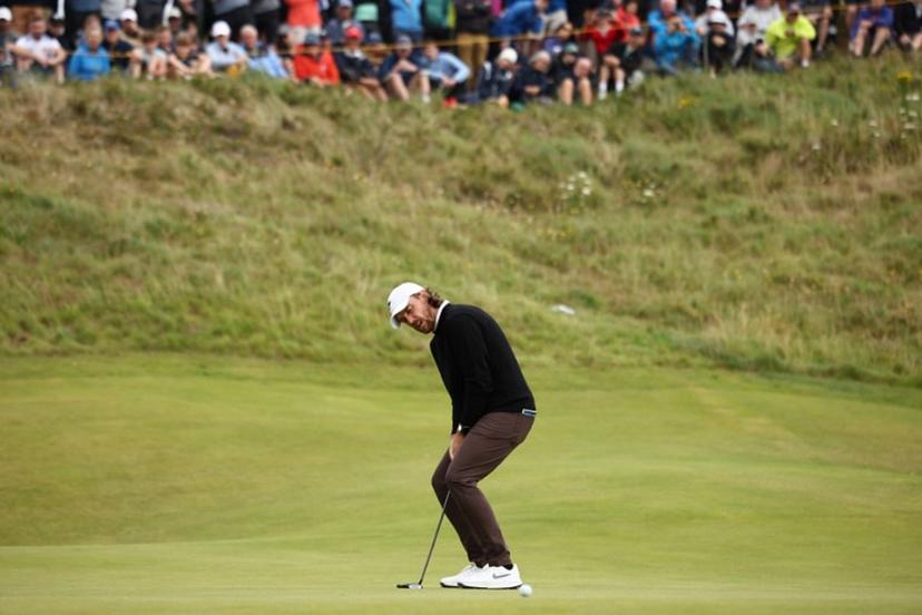England's Tommy Fleetwood reacts to a missed putt on the 7th green on day two of the 153rd Open Championship at Royal Portrush golf club in Northern Ireland on July 18, 2025.  HENRY NICHOLLS / AFP