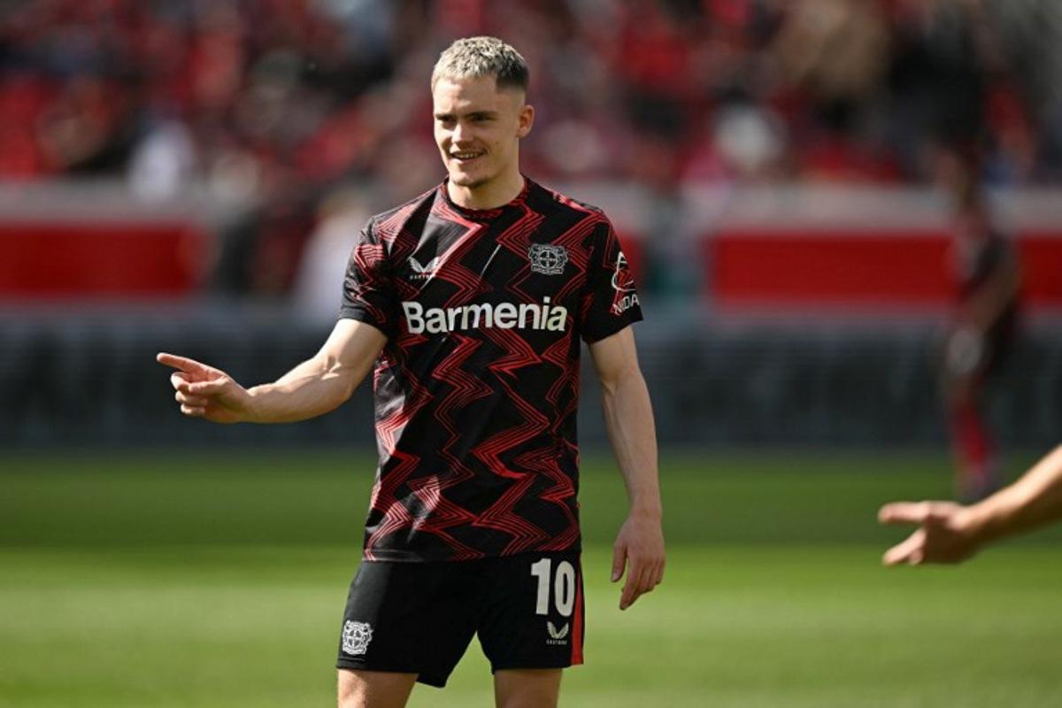 Bayer Leverkusen's German midfielder #10 Florian Wirtz warms up prior to the German first division Bundesliga football match between Bayer Leverkusen and Union Berlin in Leverkusen, western Germany, on April 12, 2025.  INA FASSBENDER / AFP