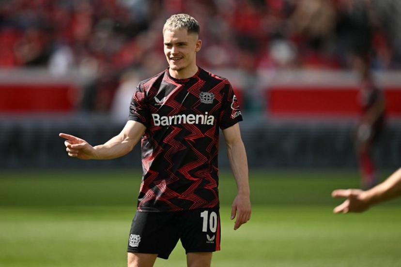 Bayer Leverkusen's German midfielder #10 Florian Wirtz warms up prior to the German first division Bundesliga football match between Bayer Leverkusen and Union Berlin in Leverkusen, western Germany, on April 12, 2025.  INA FASSBENDER / AFP
