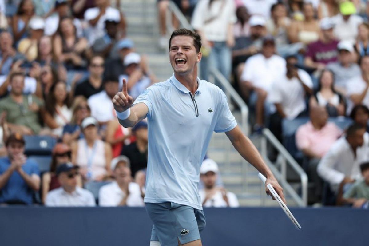 Belgium's Alexander Blockx celebrates defeating Italy's Flavio Cobolli during at the end of their men's singles third round tennis match on day seven of the US Open tennis tournament at the USTA Billie Jean King National Tennis Center in New York City on September 5, 2026.  TIMOTHY A. CLARY / AFP