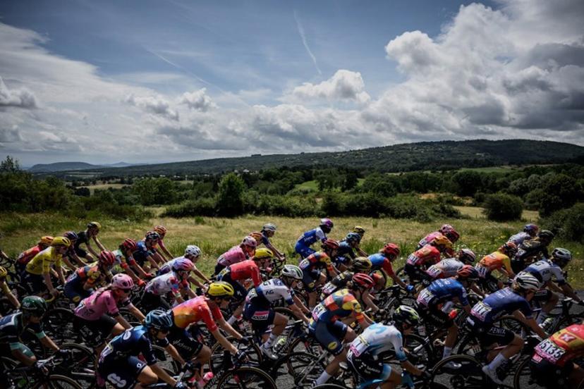 The pack rides during the second stage (out of 8) of the second edition of the Women's Tour de France cycling race 151 km between Clermont-Ferrand and Mauriac, in the Auvergne-Rhone-Alpes region, south-eastern France, on July 24, 2023.   JEFF PACHOUD / AFP