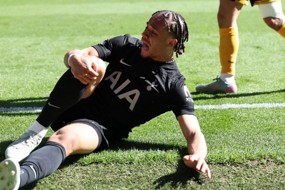 Tottenham Hotspur's Dutch midfielder #07 Xavi Simons reacts after suffering a knock during the English Premier League football match between Wolverhampton Wanderers and Tottenham Hotspur at the Molineux stadium in Wolverhampton, central England on April 25, 2026.  Darren Staples / AFP